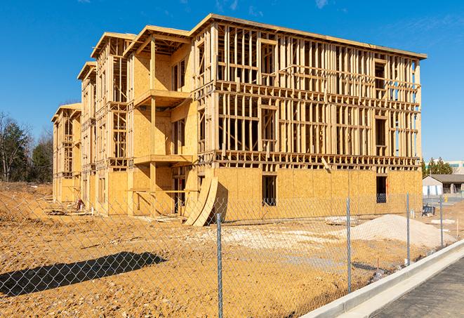 a temporary chain link fence winding around a job site, outlining the project's progress in San Fernando, CA